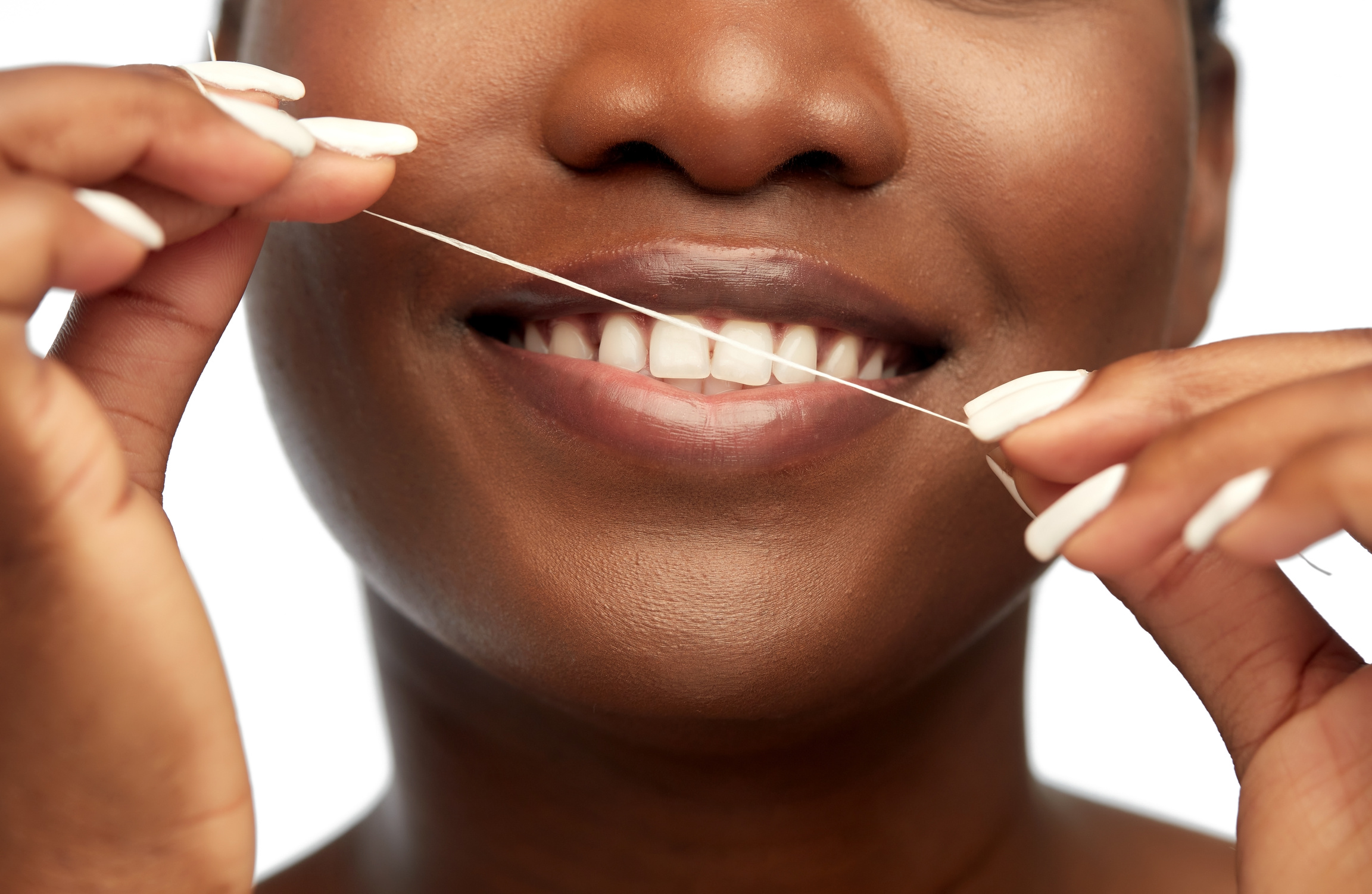 African Woman Cleaning Teeth with Dental Floss
